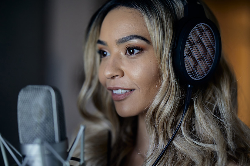 Julie Signing with BRAVURA Headphones