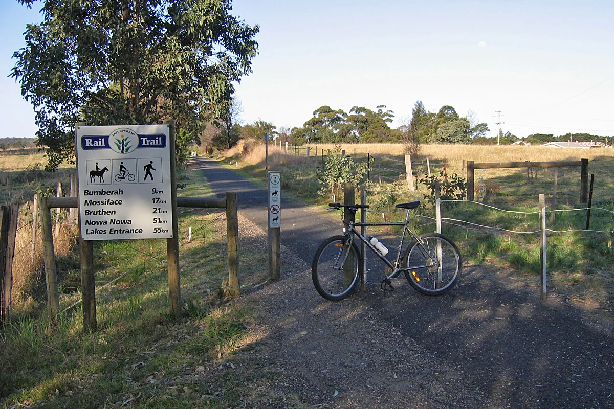 Bike at with sign to the East Gippland Rail Trail. 