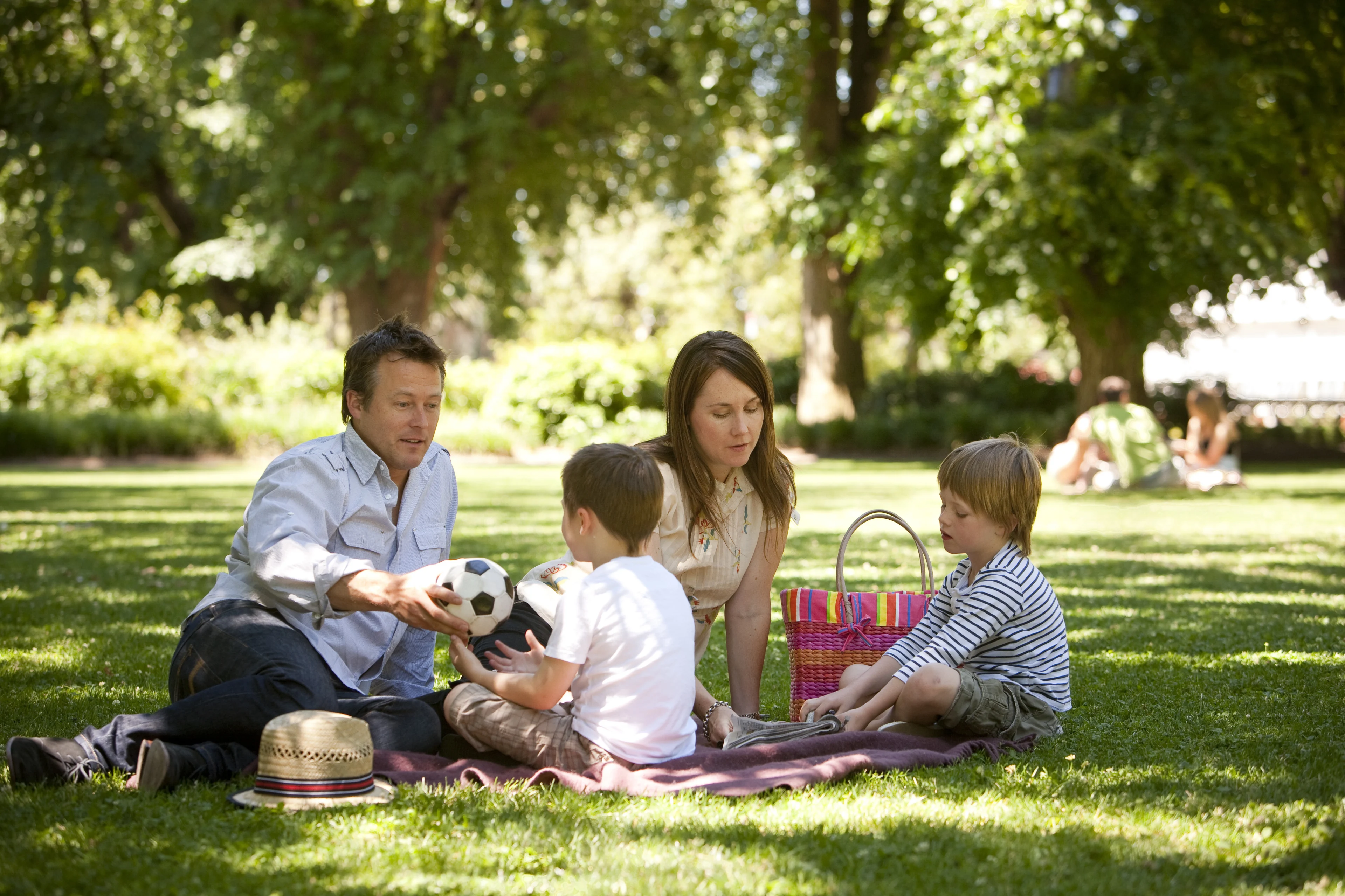 A family having a rest in Rosalind Park, Bendigo, Victoria.