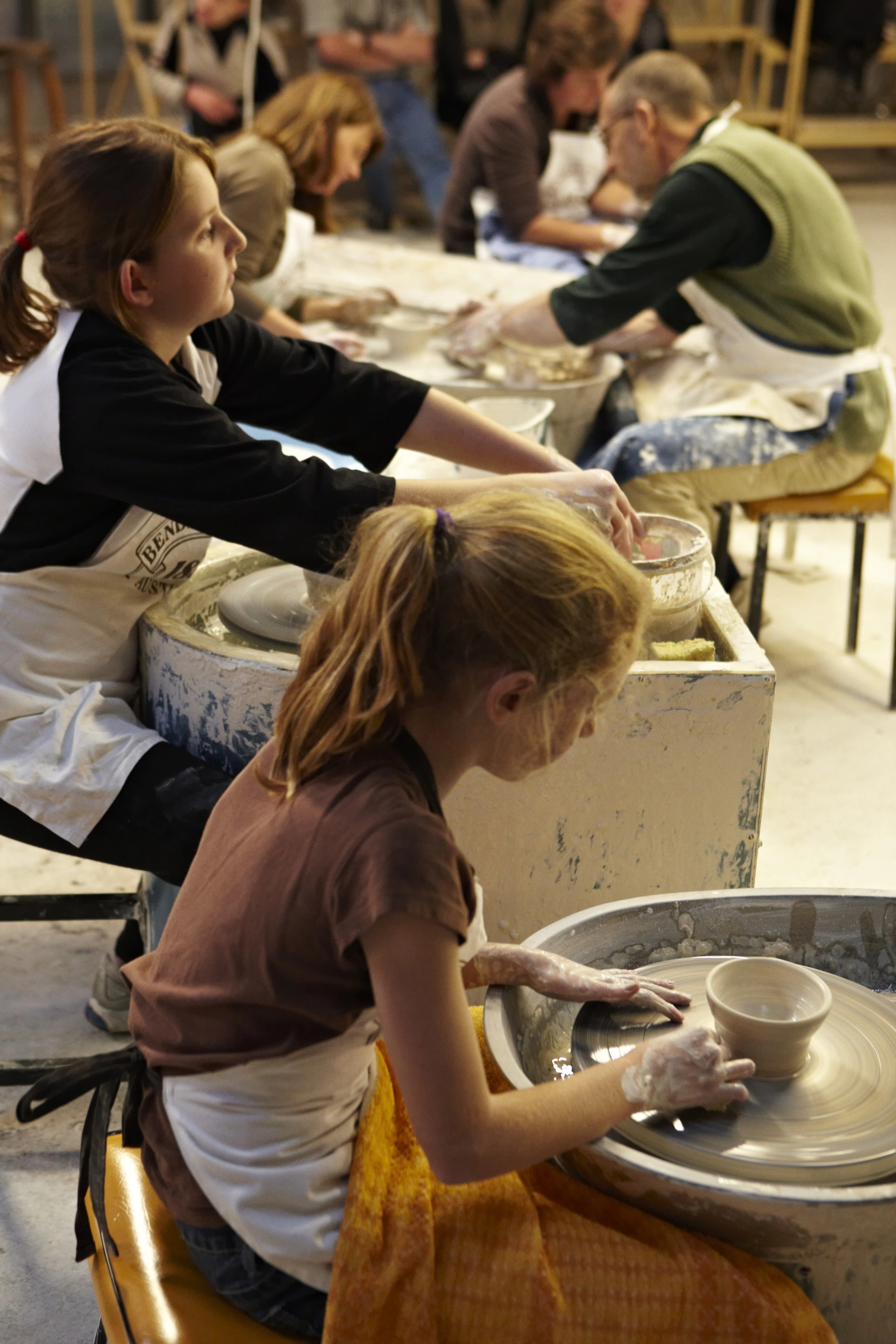 Kids at a wheel throwing class at Bendigo Pottery. Bendigo, Victoria.