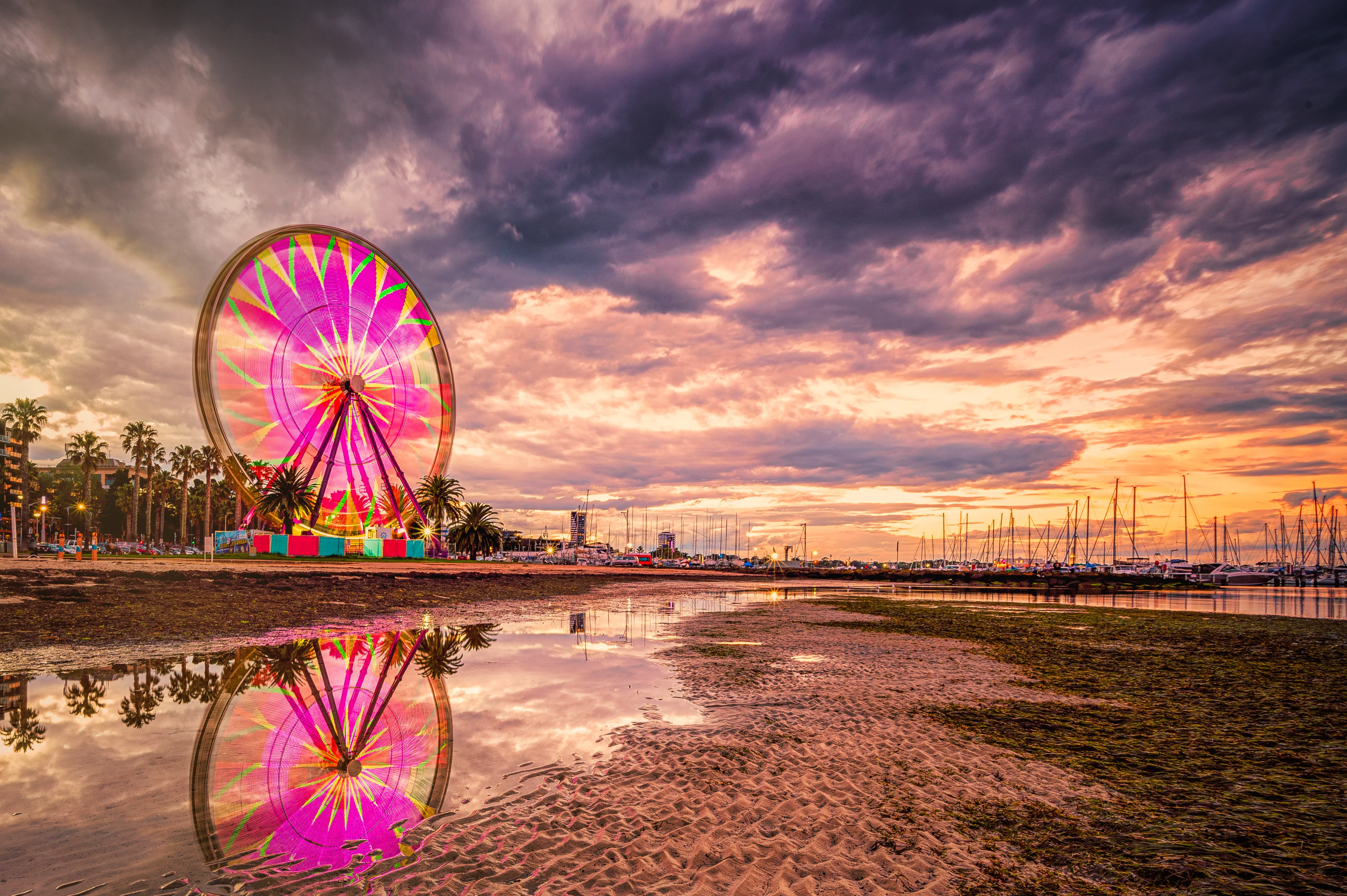 The ferris wheel lit up in bright lights. The attraction is known as the Giant Sky Wheel on the Geelong waterfront.