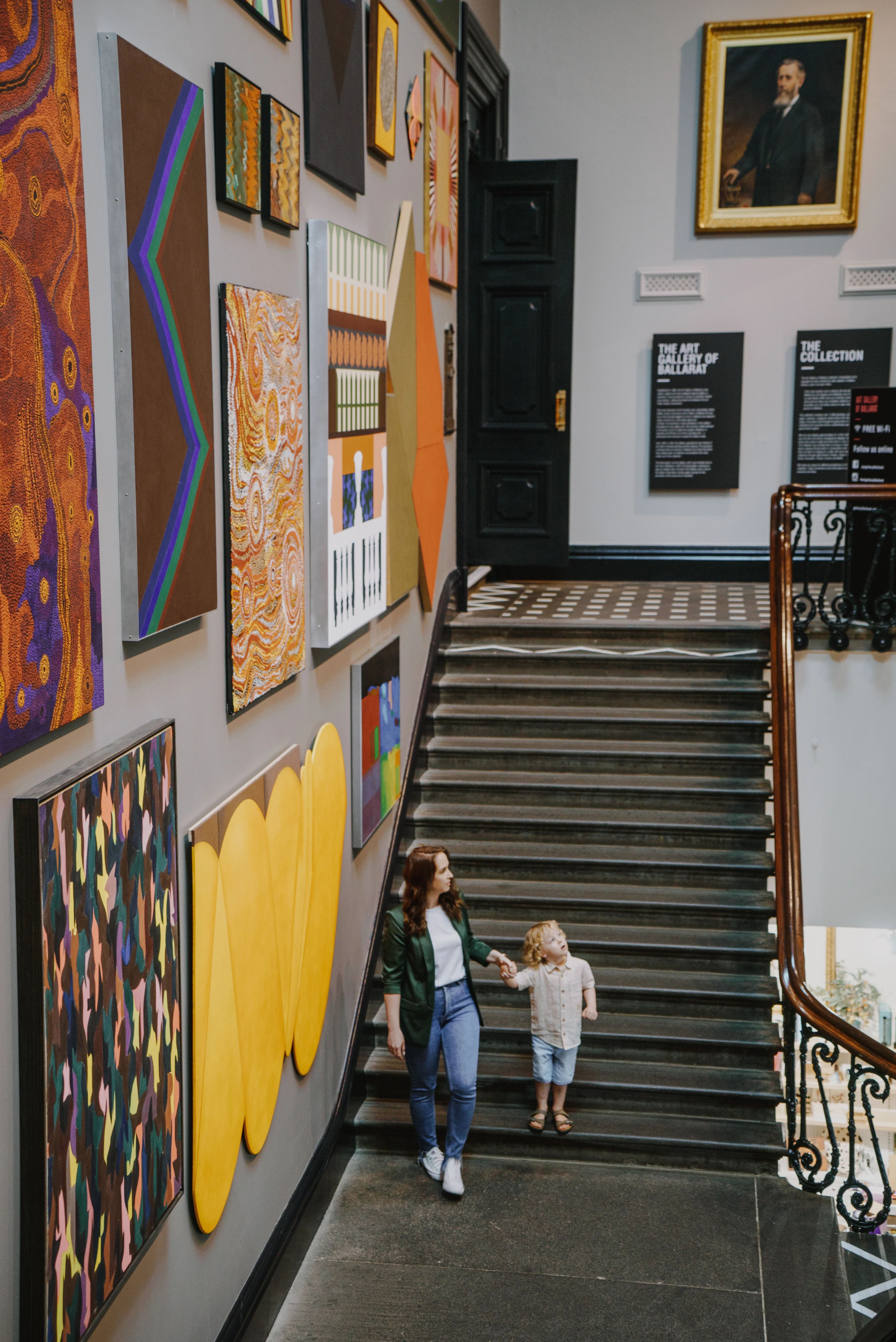 Woman and child looking at the artworks inside the Art Gallery of Ballarat 