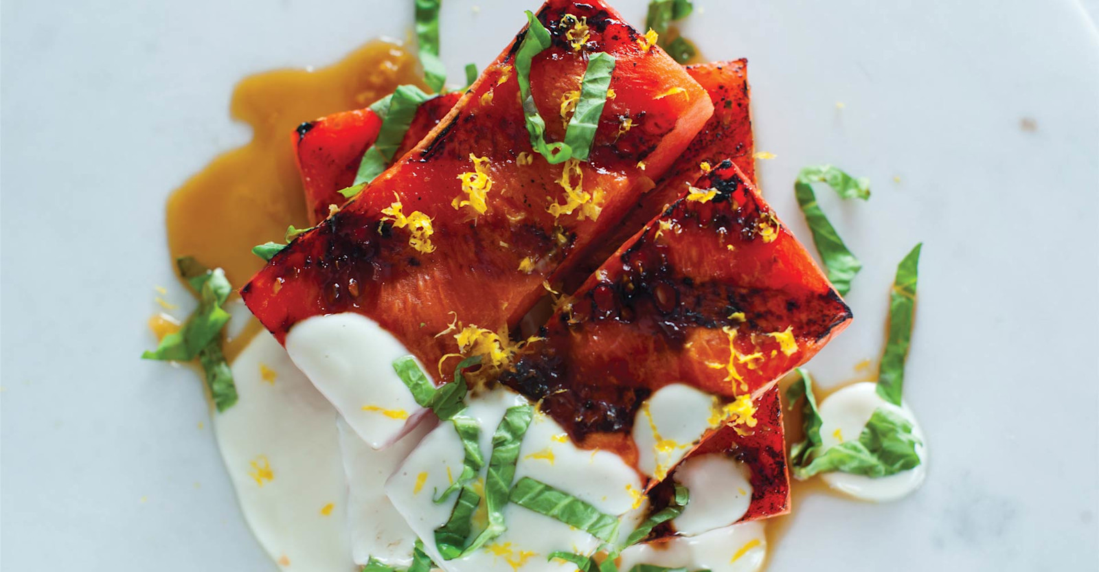 Grilled Watermelon with Lemon Zest, Basil, and Goat Cheese-Yogurt Sauce Recipe Primary Image