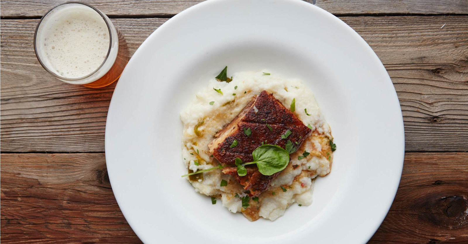 Beer-Braised Pork Belly with Green Chili White Cheddar Grits Recipe Primary Image