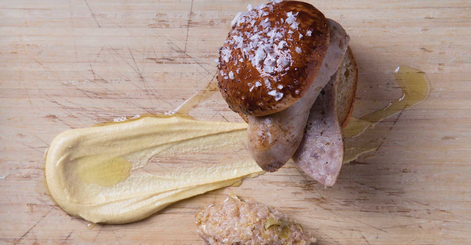 Märzen Sugar-Cured Bratwurst with Malt-Fermented Kraut on a Pretzel Bun Recipe Primary Image