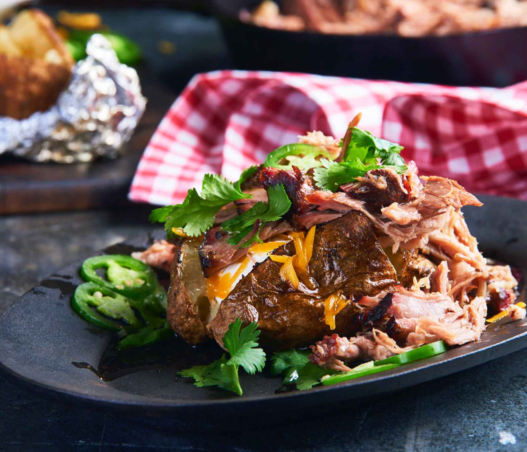 Barbecue Baked Potatoes with Smoked Pork Shoulder | Kingsford™