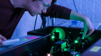 Scientist working with laser machine