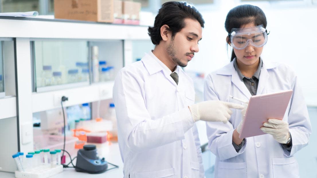 Two scientists working in a library