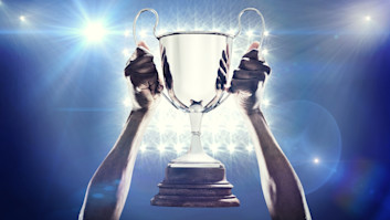 sports player with winners cup