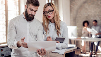 Two project managers working on a new idea - How to become a project manager