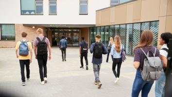 Students walking into university building