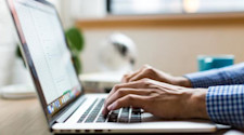 Student on laptop submitting UCAS application