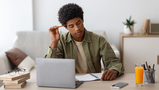 Student on laptop writing their personal statement