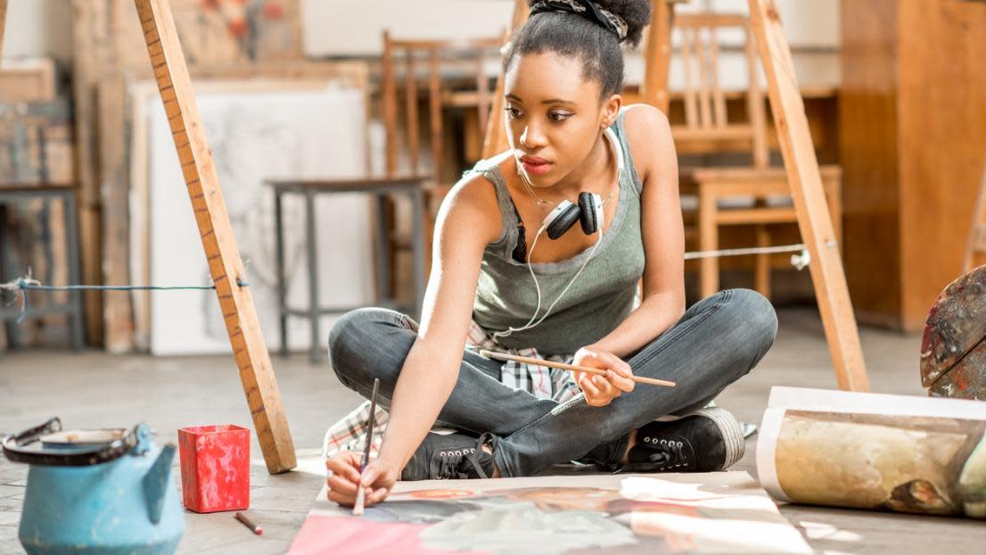 Creative student painting at university