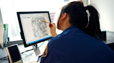 girl analysing fingerprint on criminology course
