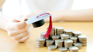 Mortarboard on pennies for student loan