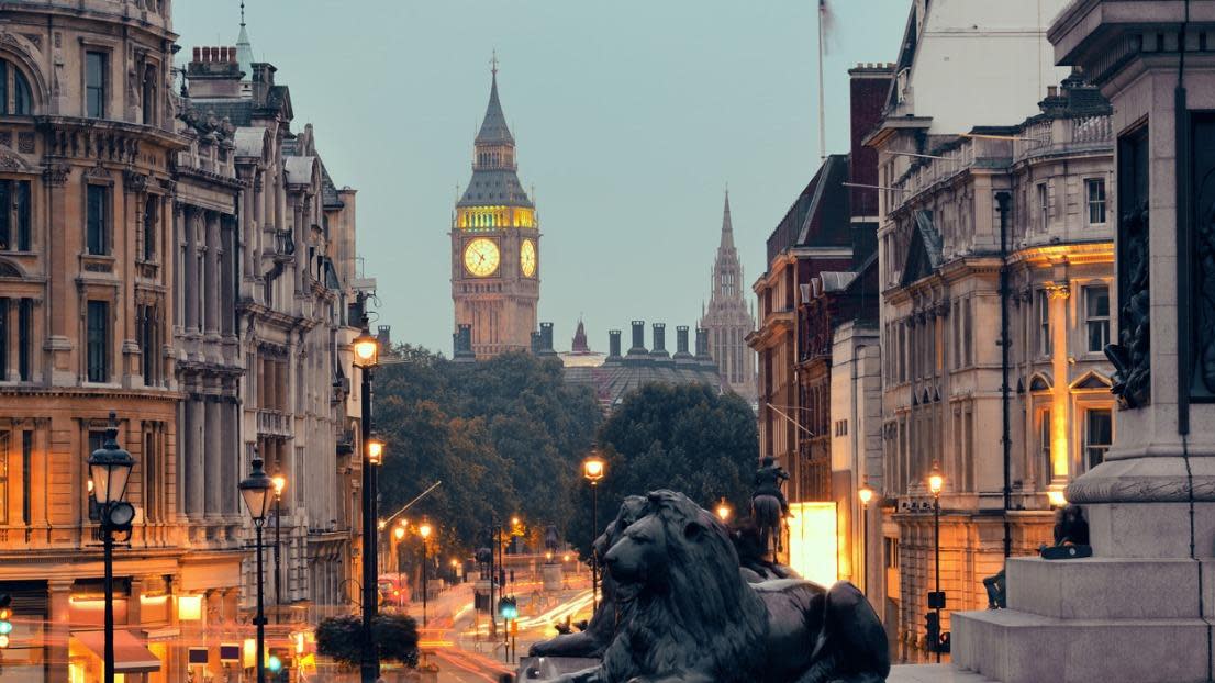 Street view of Trafalgar Square at night in London