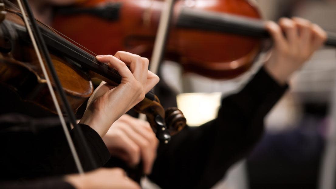 Hands of a girl playing the violin