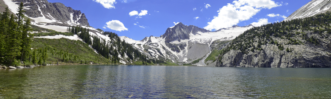 Rocky mountains in background with lake in foreground