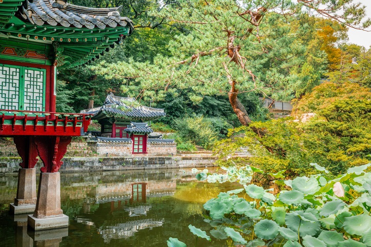 A pond, two pavilions and varied green flora in the Huwon secret garden at Changdeokgung palace in Seoul