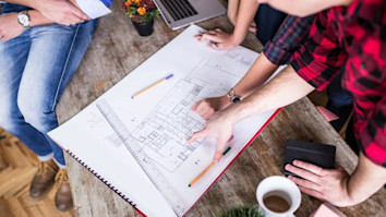 Four young architects working on a project