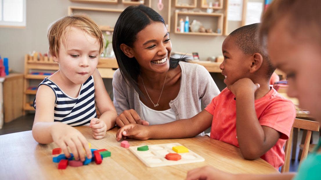 Early years teacher teaching kindergarten children