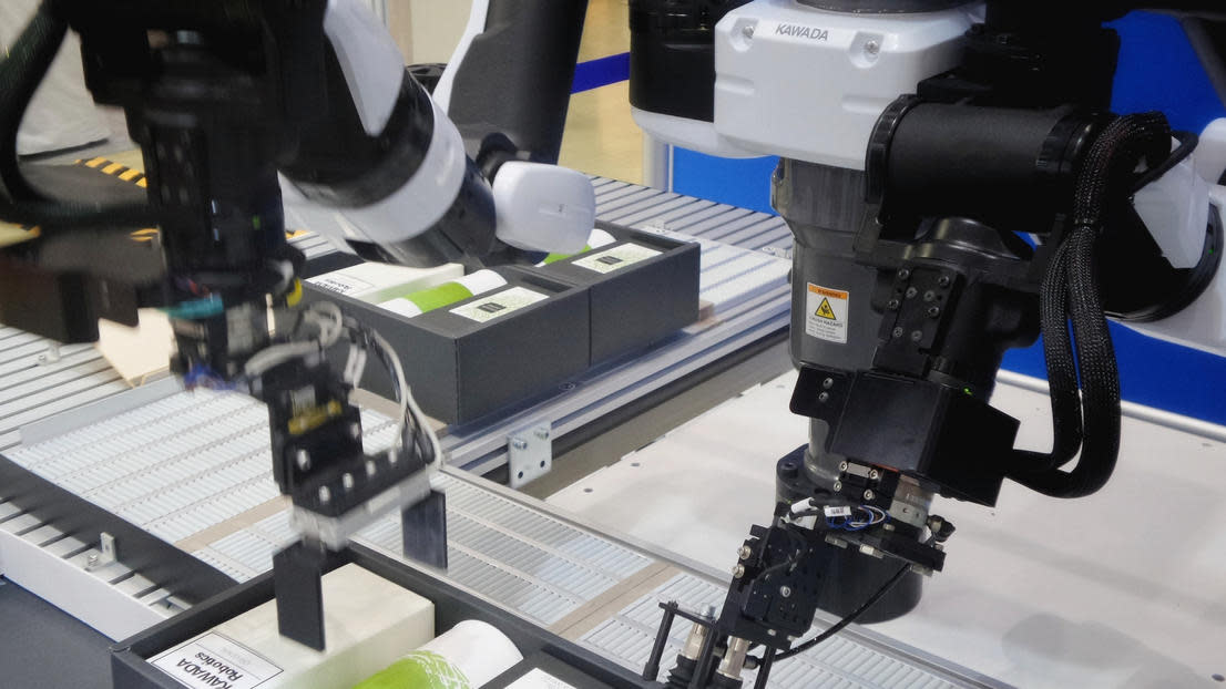 Artificially intelligent robot putting on a label