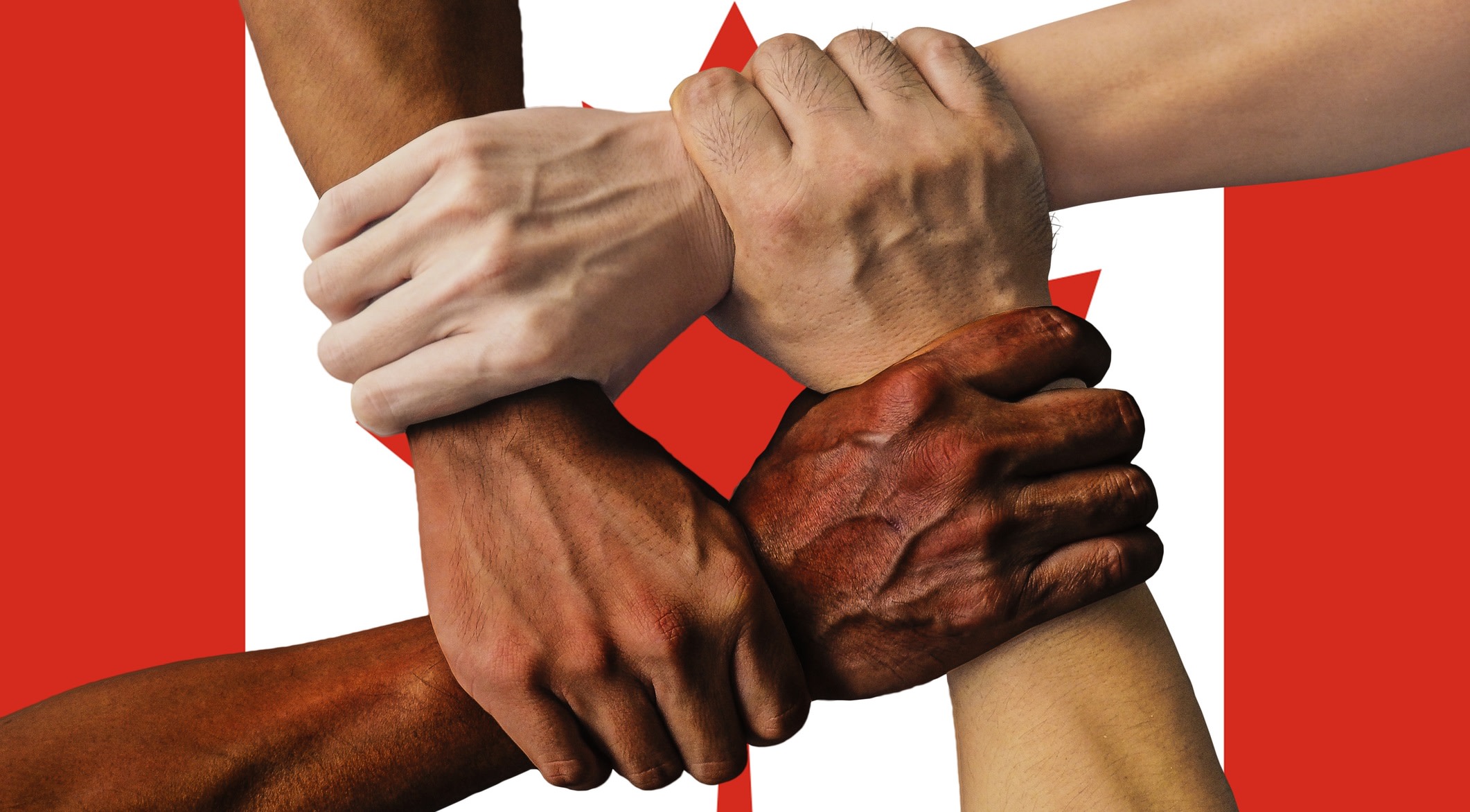 Four hands symbolise strength in unity by clenching each other's accompanying arms to form a square over the flag of Canada