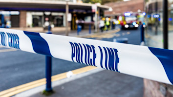 Blue and white police cordon ribbon in a London street