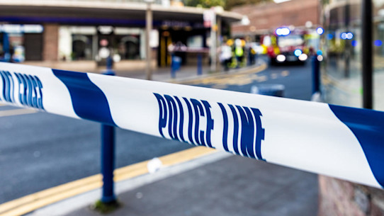 Blue and white police cordon ribbon in a London street