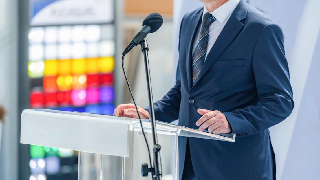 Diplomat speaking at a podium