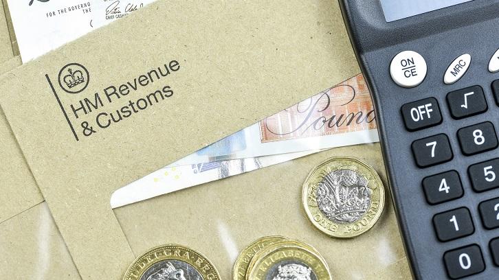 HMRC stamped envelope with money and calculator