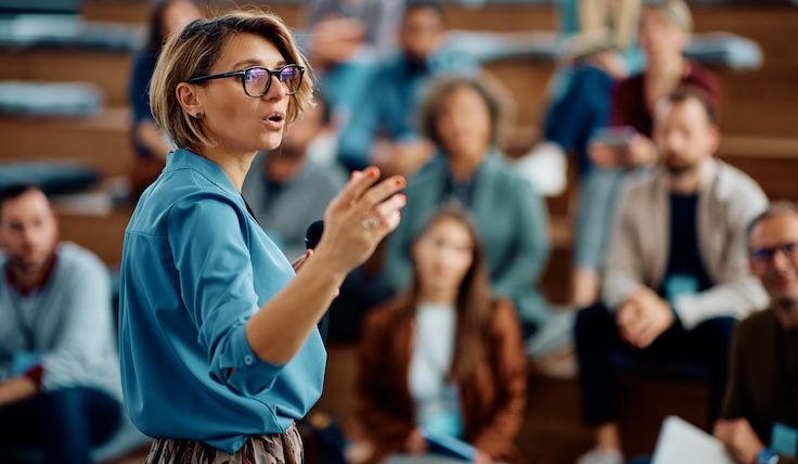 Female lecturer giving a presentation during business seminar