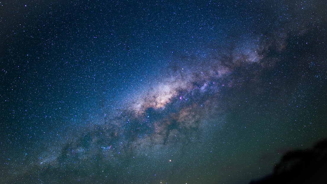 Space and stars with deep purple and blue tones