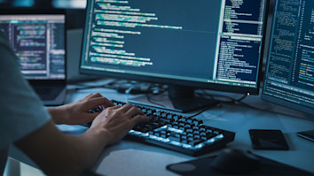 Student learning coding on a software engineering degree in the UK