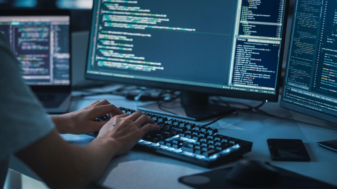 Student learning coding on a software engineering degree in the UK