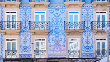Traditional historic facade in Porto decorated with blue tiles