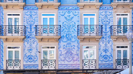 Traditional historic facade in Porto decorated with blue tiles