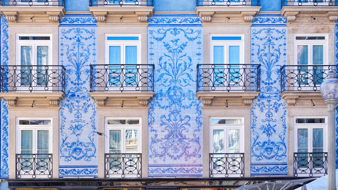 Traditional historic facade in Porto decorated with blue tiles