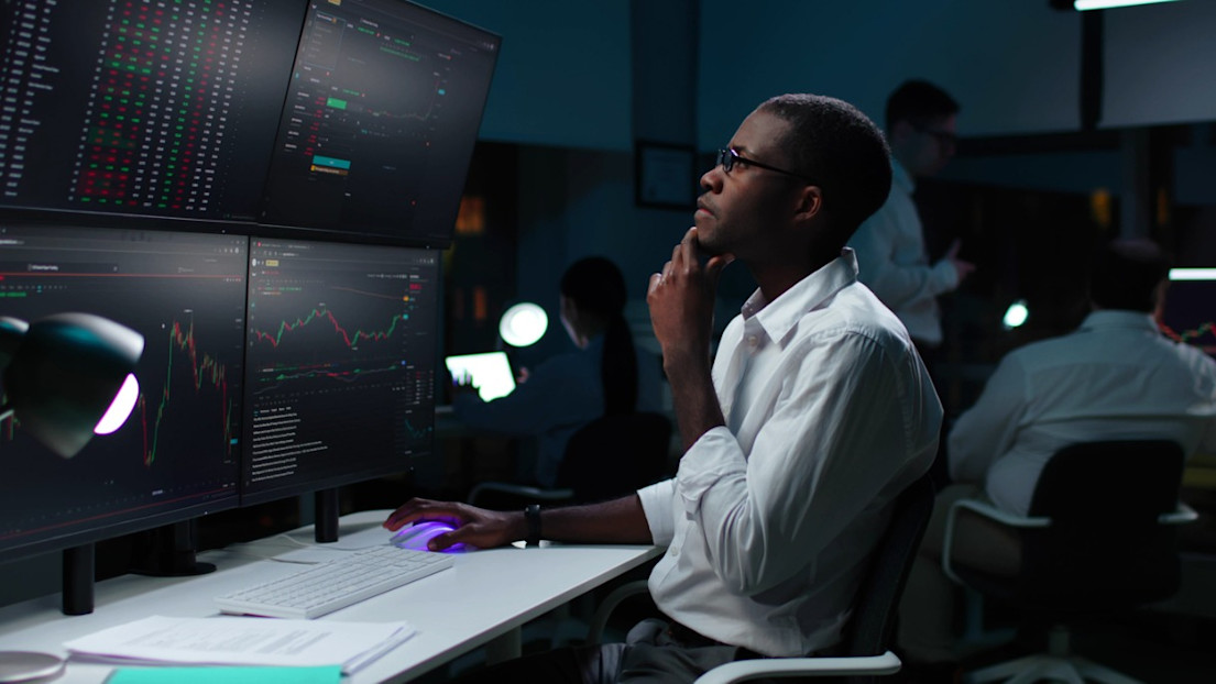 A stockbroker at his computer