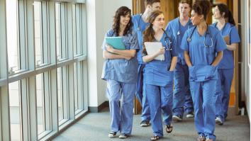 Medical students walking through corridor