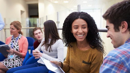 Students discussing at a university open day