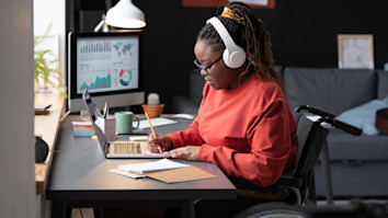 Girl with disability studying at home
