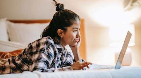 Student on laptop applying through UCAS