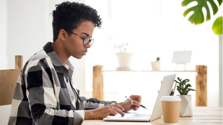 Person on laptop choosing MBA options
