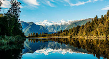 Reflections of Mount Cook and Mount Tasman in Lake Matheson, Fox Glacier, New Zealand.