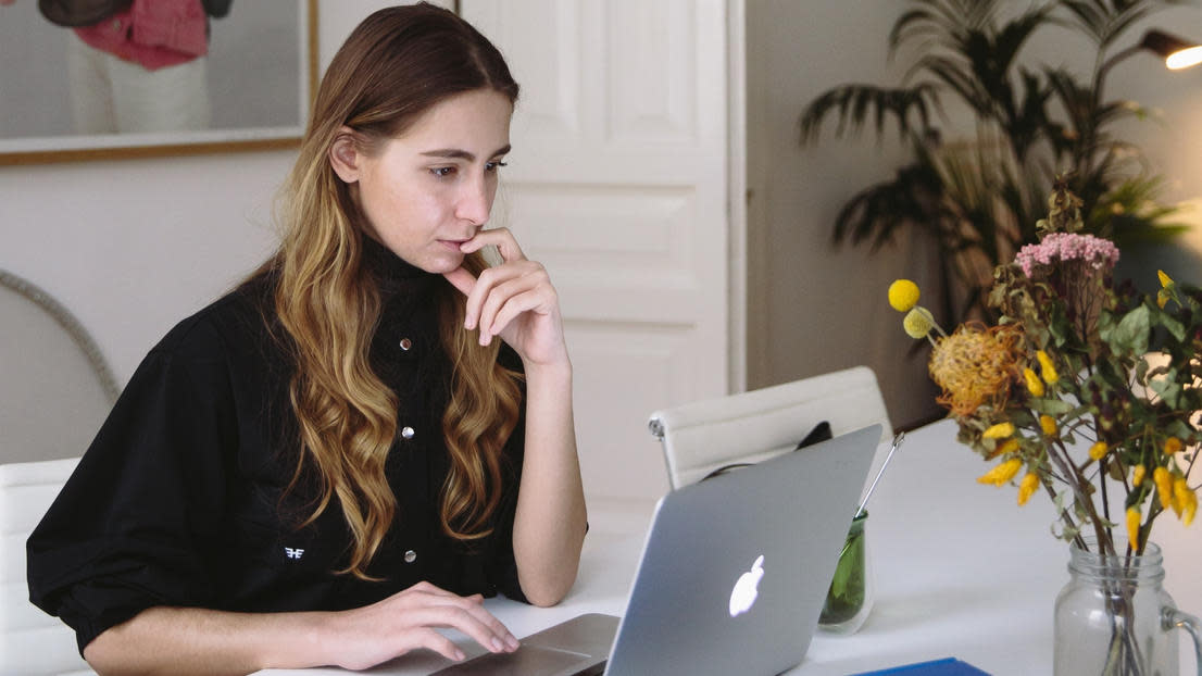 Girl sitting at her dining table studying