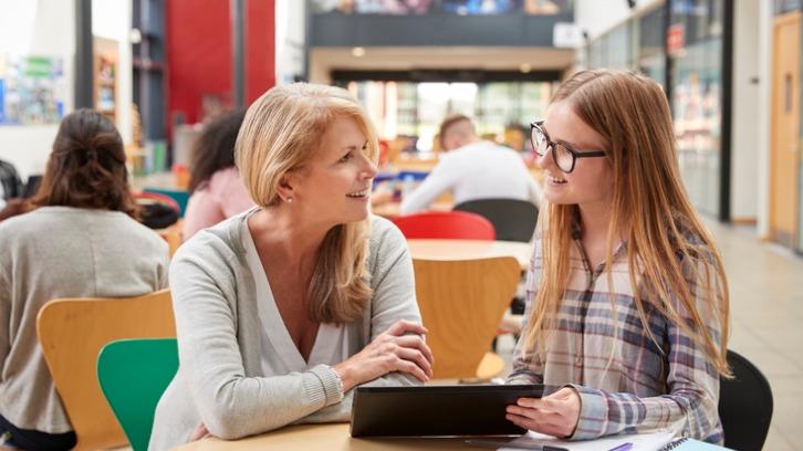 Mother and daughter discussing at a university open day