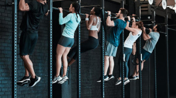 A group of students doing pull ups 