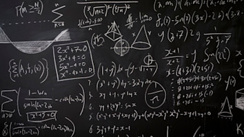 Mathematical equations on a blackboard